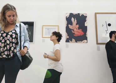 People attending an art exhibition